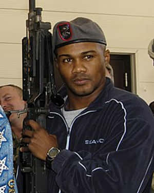 Felix Trinidad With A Gun Wallpaper