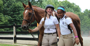 Female Equestrian Buddies With A Thoroughbred Horse Wallpaper