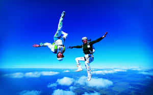 Female Skydiving Upside Down Wallpaper