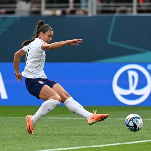 Female Soccer Player Action Shot Wallpaper