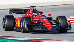 Ferrari F1 Car Driving On A Track Wallpaper