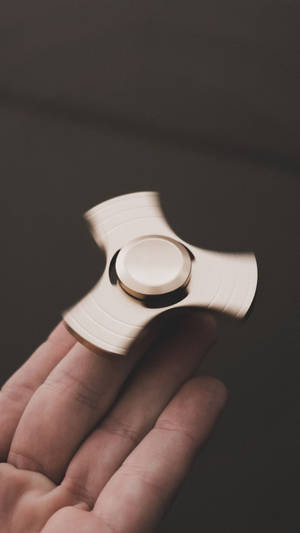 Fidget Toy On Middle Finger Wallpaper