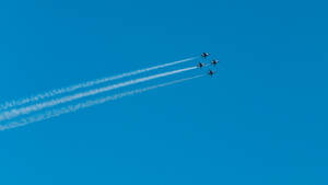 Fighter Jets Fly In Clear Blue Plain Wallpaper