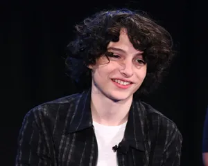 Finn Wolfhard On Stage Wallpaper
