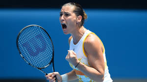 Flavia Pennetta Ecstatically Celebrating Her Victory On The Tennis Court Wallpaper