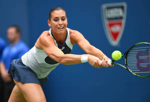 Flavia Pennetta In Action On The Tennis Court Wallpaper