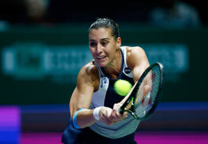 Flavia Pennetta Reaching For Ball Wallpaper