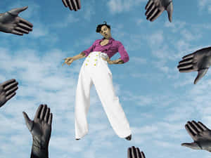 Floating Artist Surroundedby Hands Wallpaper