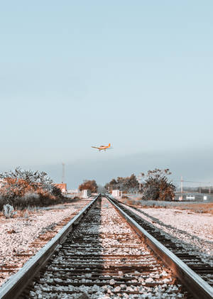 Flying Orange Small Plane Wallpaper