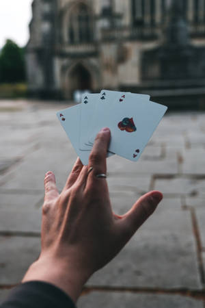 Focus Hand Holding Playing Cards Wallpaper