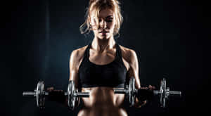 Focused Fitness Session Dumbbell Workout Wallpaper