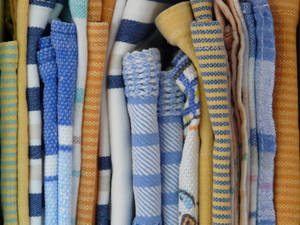 Folded Clothes With Prints Close-up Wallpaper