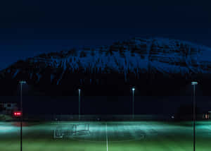 Football Field During Night Time Wallpaper