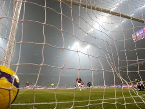 Football Players In The Heat Of The Game Wallpaper