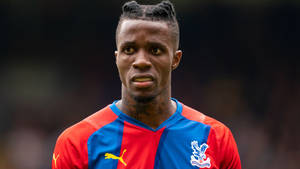 Footballer Wilfried Zaha Sporting Intricate Braids Hairstyle. Wallpaper