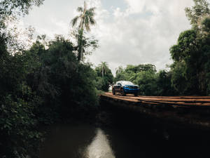 Ford Raptor Crossing A Bridge Wallpaper