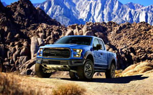 Ford Raptor On Mountain Terrain Wallpaper