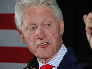 Former President Bill Clinton With A Focused Expression Wallpaper