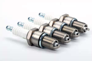 Four Spark Plug White Background Wallpaper