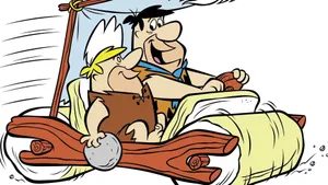 Fred Flintstone In Flintmobile Wallpaper