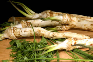 Fresh Horseradish Root On A Chopping Board Wallpaper