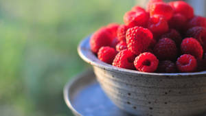 Fresh Raspberries In A Stoneware Bowl Wallpaper