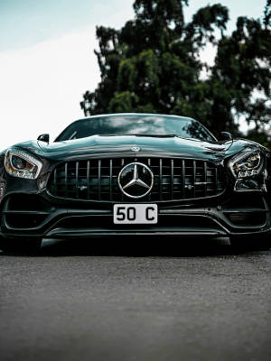 Front View Of A Gleaming Amg Vehicle Wallpaper