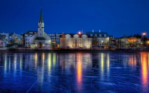 Frozen Lake Near City Wallpaper
