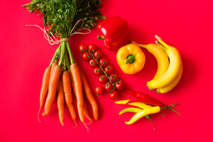 Fruits And Vegetables On Red Background Wallpaper