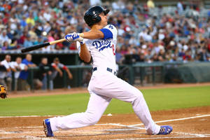 Full Body Photo Of Corey Seager Swinging Bat Wallpaper