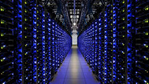 Futuristic Data Center Illuminated With Blue Lights. Wallpaper