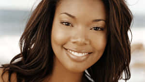 Gabrielle Union Smiling Radiantly Wallpaper