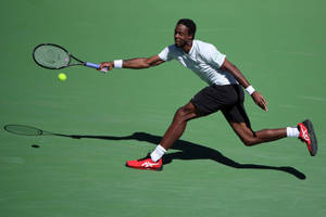 Gael Monfils In Action - An Extraordinary Athletic Performance Wallpaper