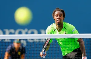 Gael Monfils In Action At A Professional Tennis Match Wallpaper