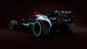 Get Moving In True Luxury With The Mercedes F1 Iphone Wallpaper