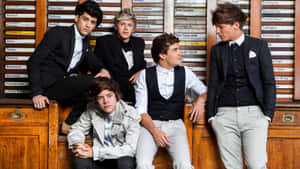 Get The One Direction Look With A Laptop Wallpaper