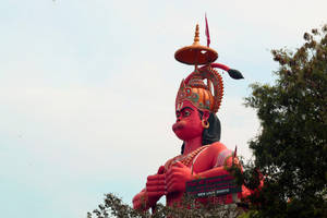 Giant Ram Ji Statue With Trees Wallpaper