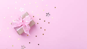 Gift Box With Baby Pink Ribbon Wallpaper