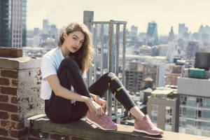 Gigi Hadid Rooftop Sitting Wallpaper