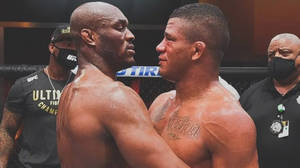 Gilbert Burns Emotionally Embracing Kamaru Usman Wallpaper