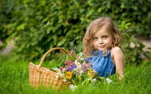 Girl Child Holding A Basket In The Grass Wallpaper