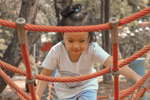 Girl In Playground Wallpaper