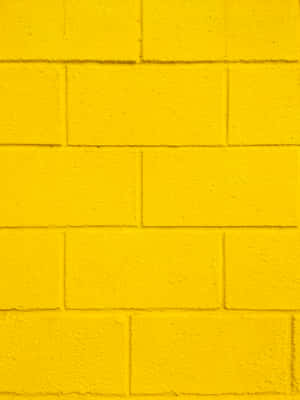 Give Your Home A Dose Of Sunshine With This Bright And Vibrant Retro Yellow Wallpaper. Wallpaper