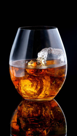 Glass Of Alcohol With Ice Reflection Wallpaper