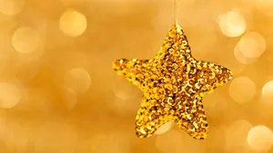 Glimmering Gold Stars Wallpaper