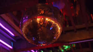 Glowing Disco Ball Party Scene Wallpaper