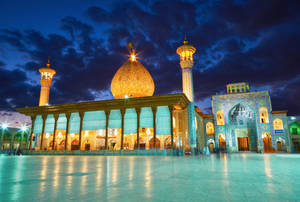 Glowing Yellow Mosque In Iran Wallpaper