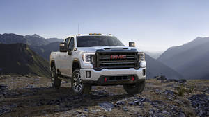 Gmc On A Rocky Mountain Wallpaper