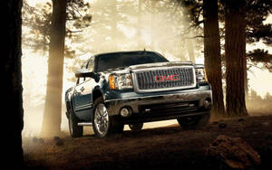 Gmc Sierra In A Forest Wallpaper