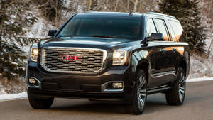 Gmc Yukon On The Road Wallpaper